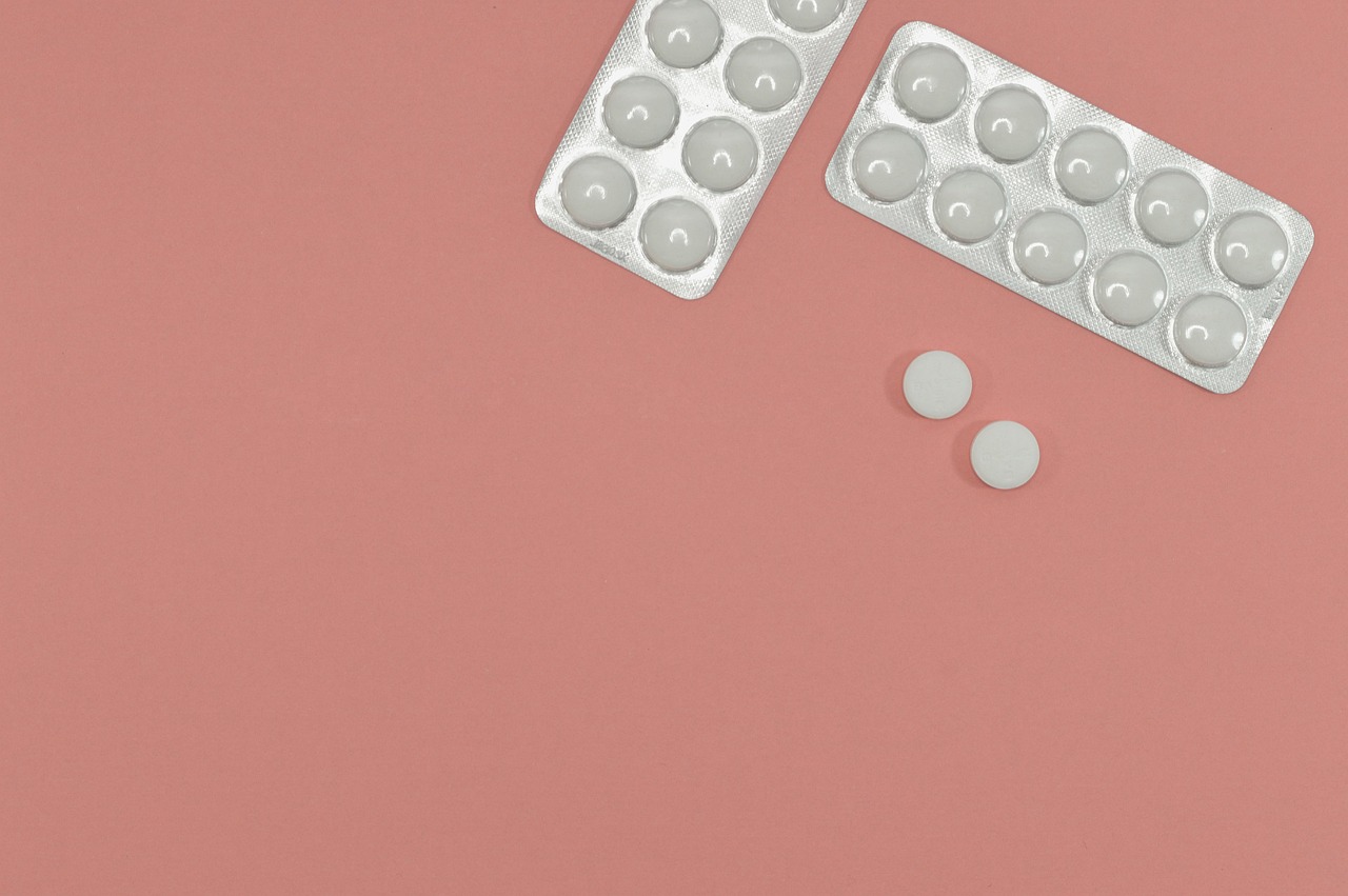972 Something old becomes something new aspirin tablets on peach background