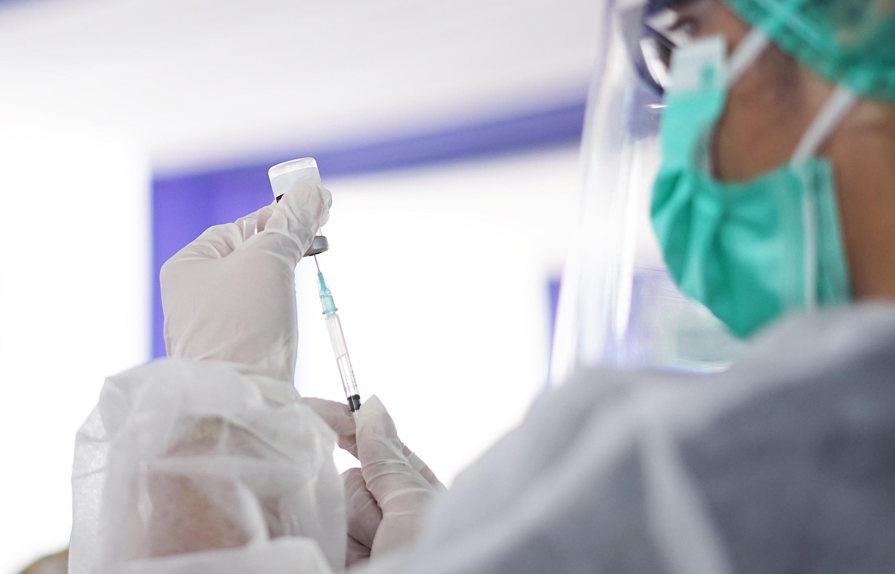 979 Theres afungus among us lab personnel drawing fluid from syringe