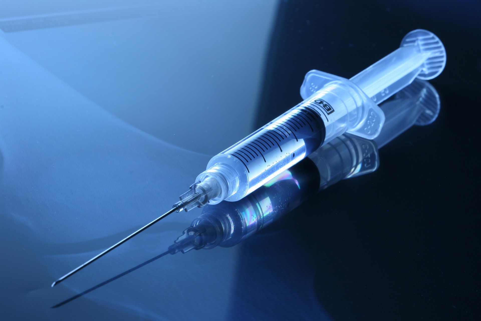 hypodermic needle filled with vaccine fluid